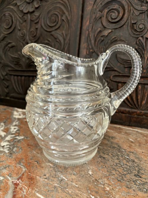 A LARGE IRISH CUT LEAD CRYSTAL WATER JUG C1840