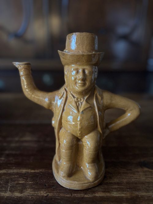 A Rare Rockingham Yellow Treacle Glazed John Bull Teapot C1840-50
