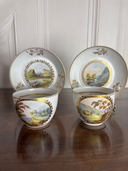 a pair of 1st period minton pattern no 58 cups saucers landscapes - CATEGORY: ANTIQUE CUPS - DATED 1850