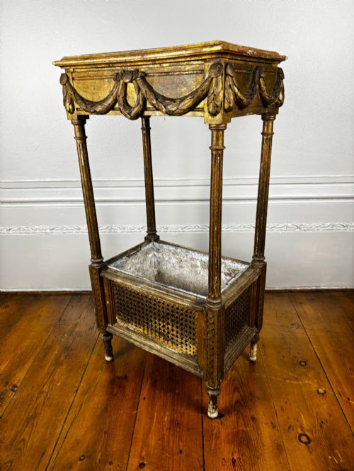 A French Empire Two Tiered Caned Giltwood Jardinere Stand C1810