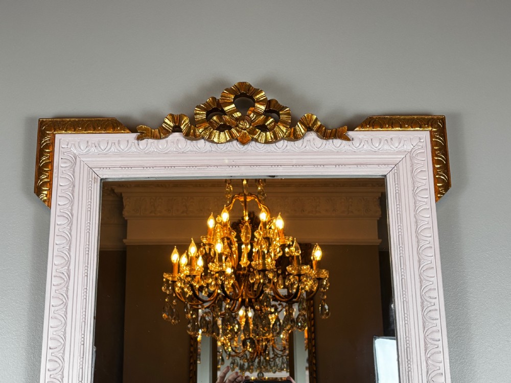 Rectangular late nineteenth-century French mirror featuring a painted white frame with gilded cresting and decorative corner accents. View III