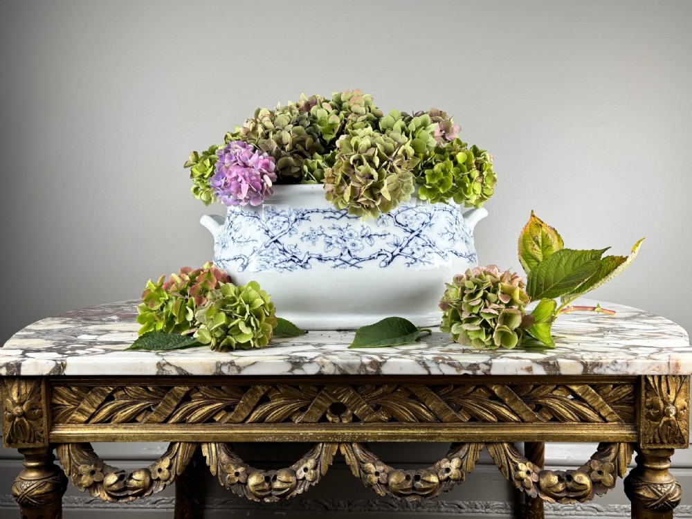 A large oval Victorian blue and white transferware ceramic footbath featuring two side handles and a floral branch pattern. View II
