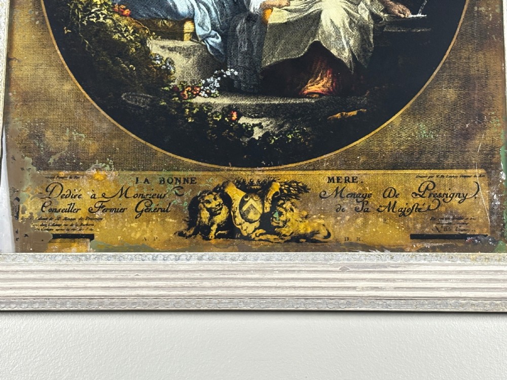 A Georgian reverse print on glass displaying a figure scene inside an oval vignette within a silvered moulded frame. View III