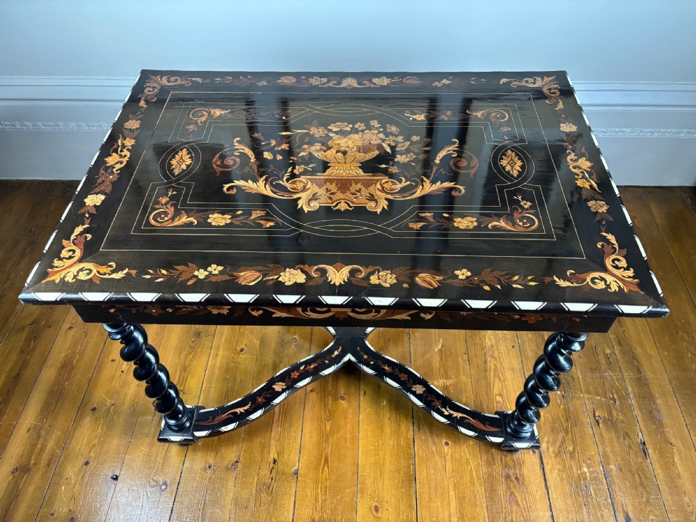 A 19th-century Dutch ebonised rectangular side table featuring floral marquetry, bone inlay borders, turned barley twist legs, and a shaped X-stretcher. View VI
