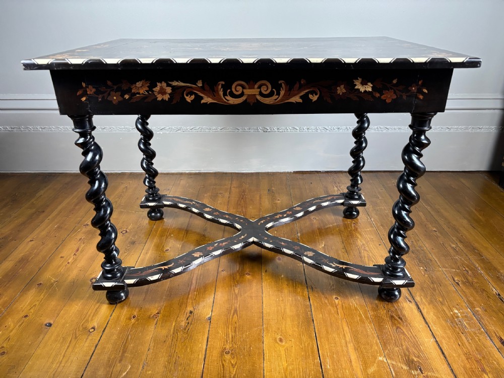 A 19th-century Dutch ebonised rectangular side table featuring floral marquetry, bone inlay borders, turned barley twist legs, and a shaped X-stretcher. View II