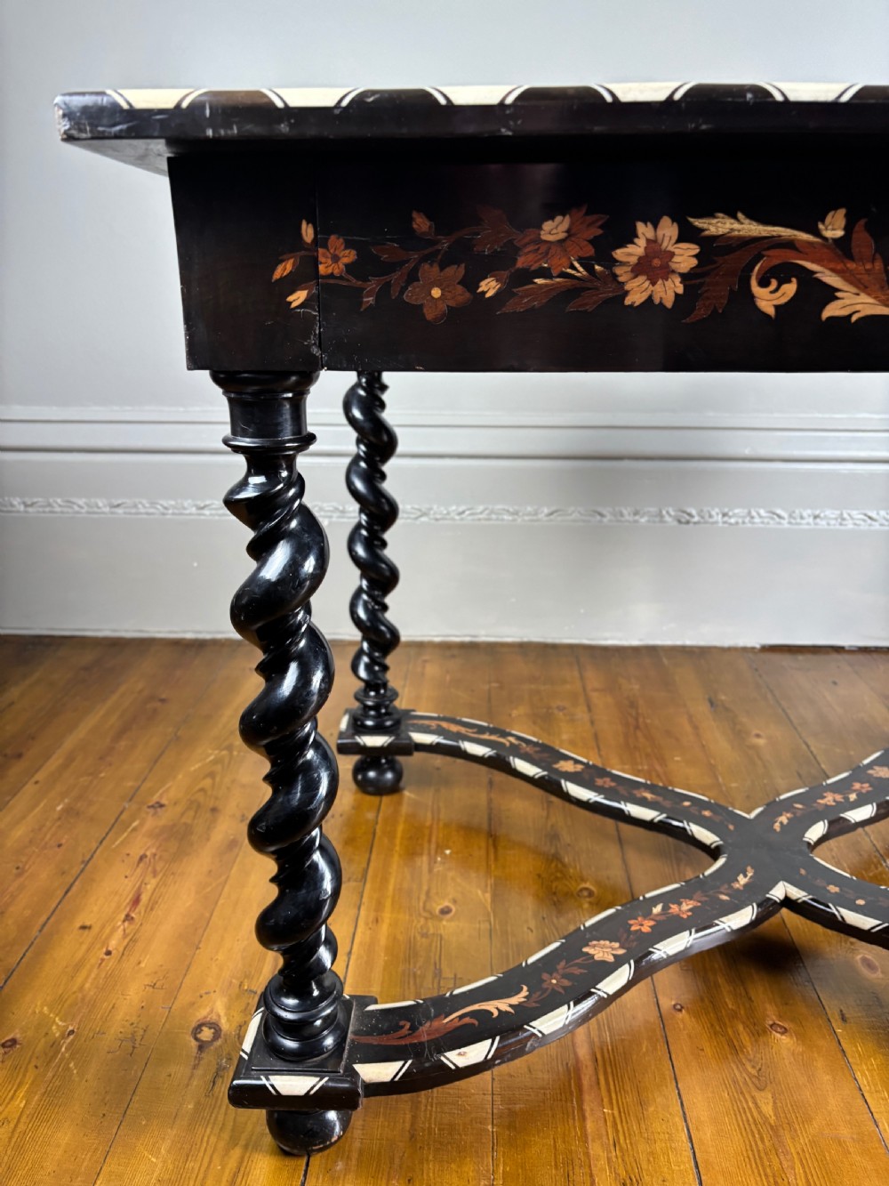 A 19th-century Dutch ebonised rectangular side table featuring floral marquetry, bone inlay borders, turned barley twist legs, and a shaped X-stretcher. View IV