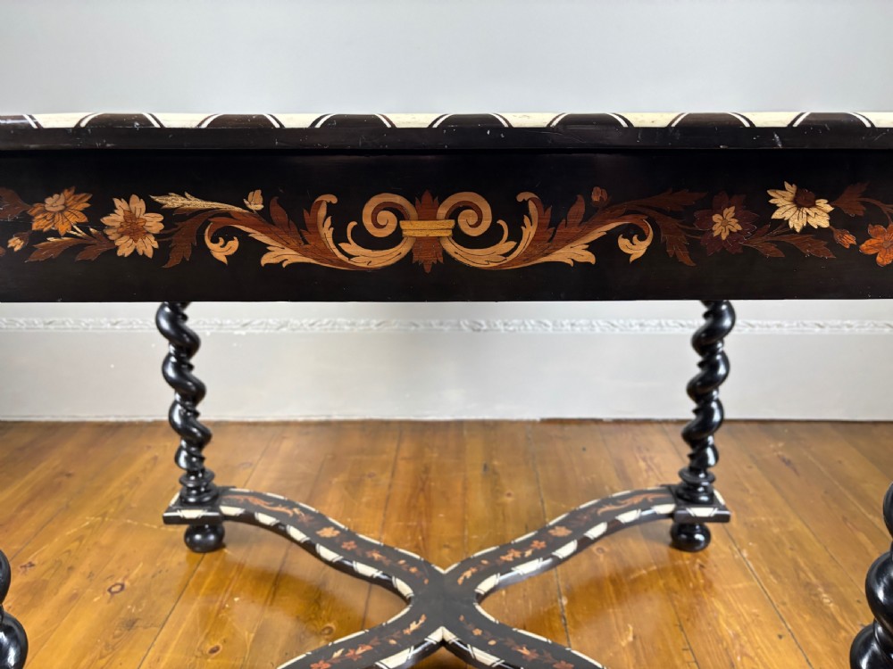 A 19th-century Dutch ebonised rectangular side table featuring floral marquetry, bone inlay borders, turned barley twist legs, and a shaped X-stretcher. View V