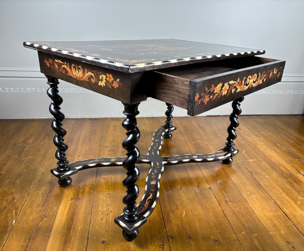 A 19th-century Dutch ebonised rectangular side table featuring floral marquetry, bone inlay borders, turned barley twist legs, and a shaped X-stretcher. View VIII