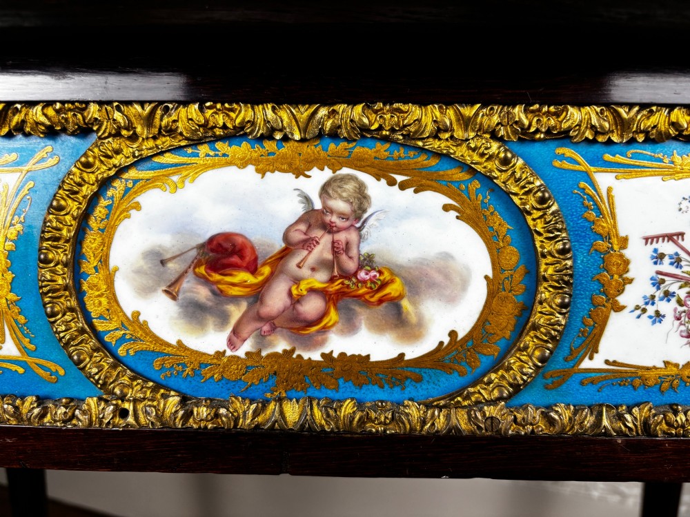 A Louis XV style rosewood writing table featuring cabriole legs, gilt bronze ormolu mounts, and turquoise porcelain plaques. View VIII