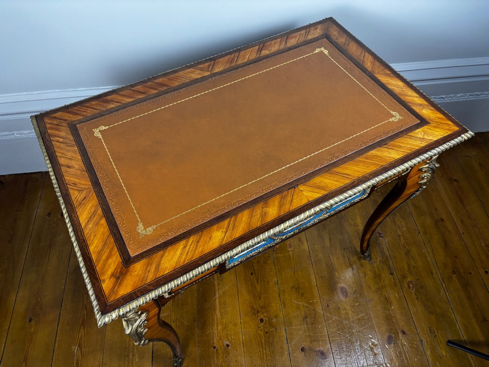 A Louis XV style rosewood writing table featuring cabriole legs, gilt bronze ormolu mounts, and turquoise porcelain plaques. View XI