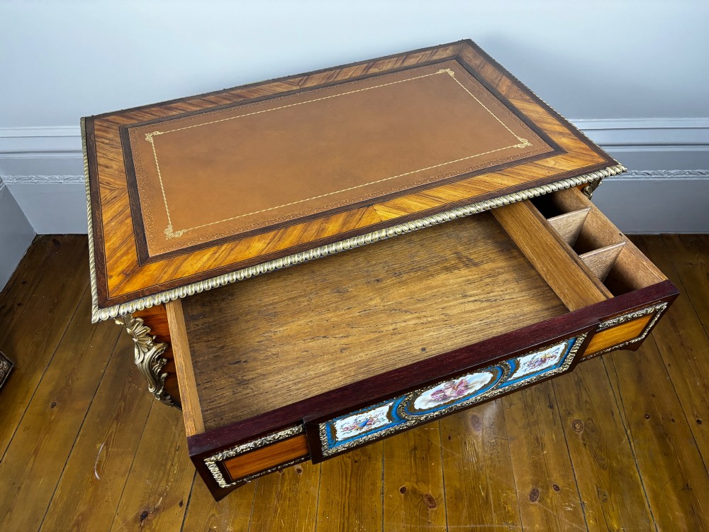 A Louis XV style rosewood writing table featuring cabriole legs, gilt bronze ormolu mounts, and turquoise porcelain plaques. View XIII
