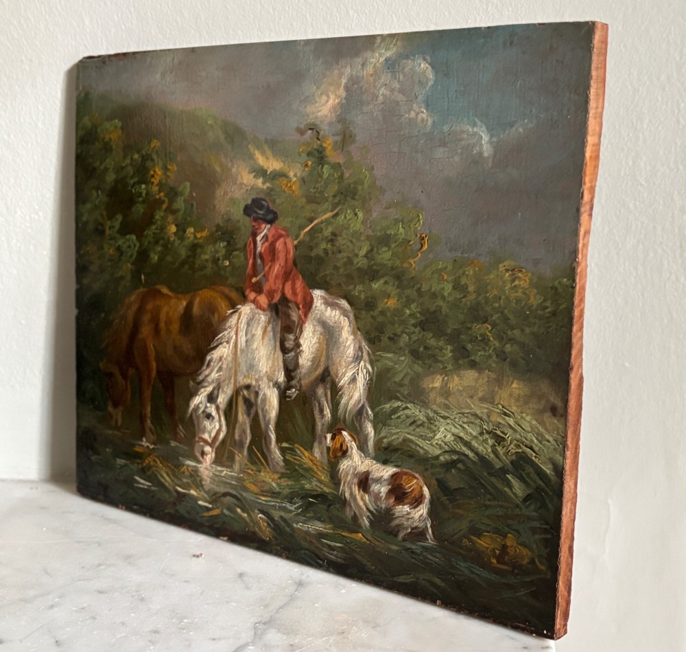 A framed Georgian oil painting on board depicting a man seated on a white horse alongside a brown horse drinking from a stream with a small dog nearby. View III