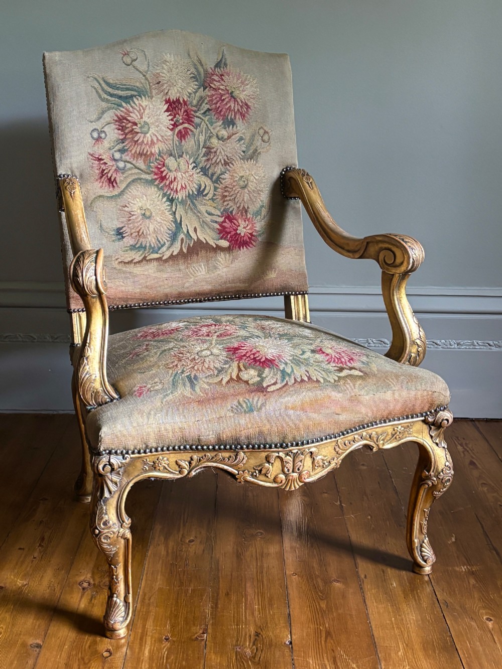 Late 19th-century French Regence style open armchair with a carved giltwood frame and floral tapestry upholstery. View II