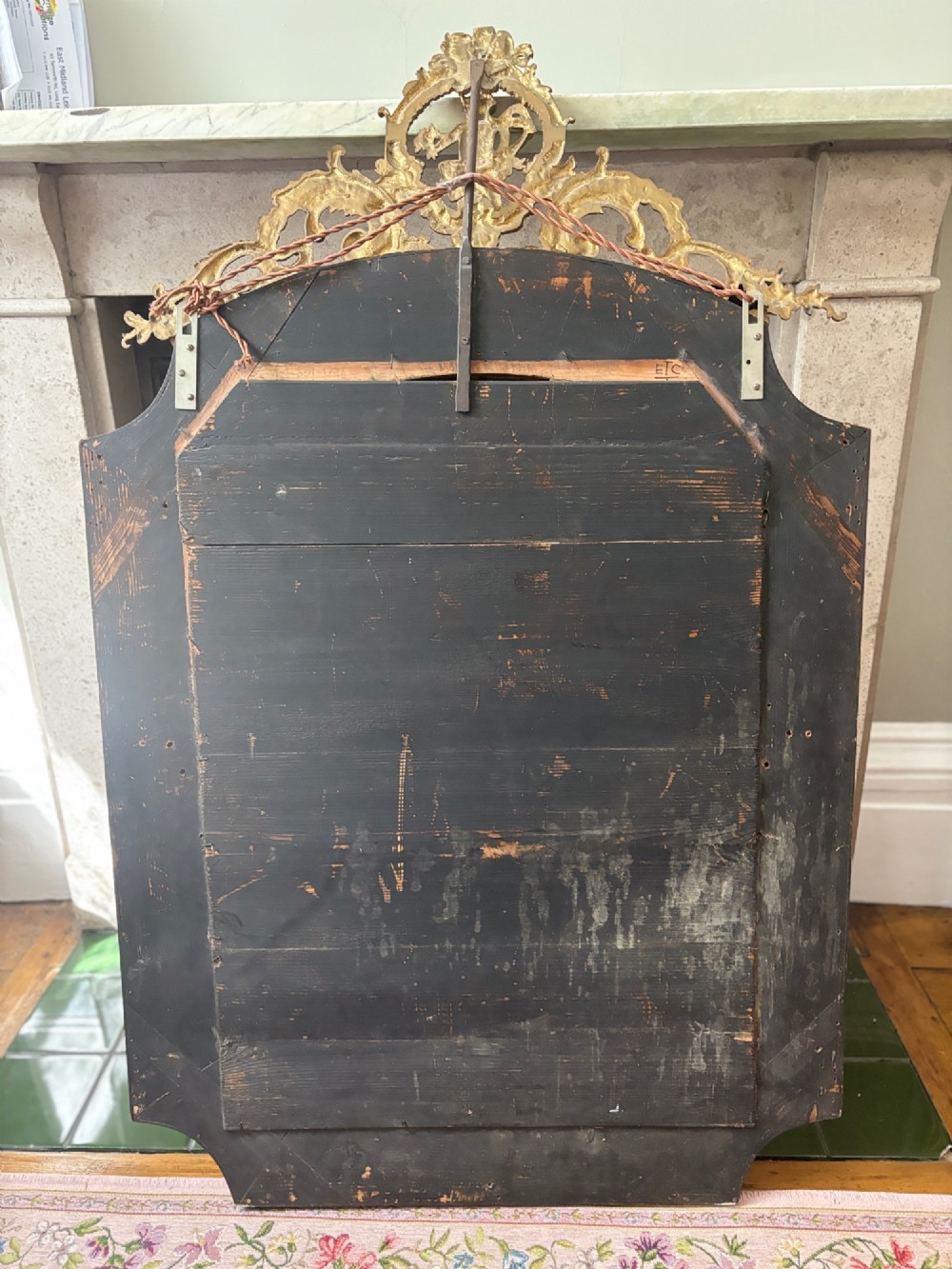 A French Louis XV style wall mirror featuring a gilt bronze frame with a cherub cresting and floral etched glass border plates. View VIII