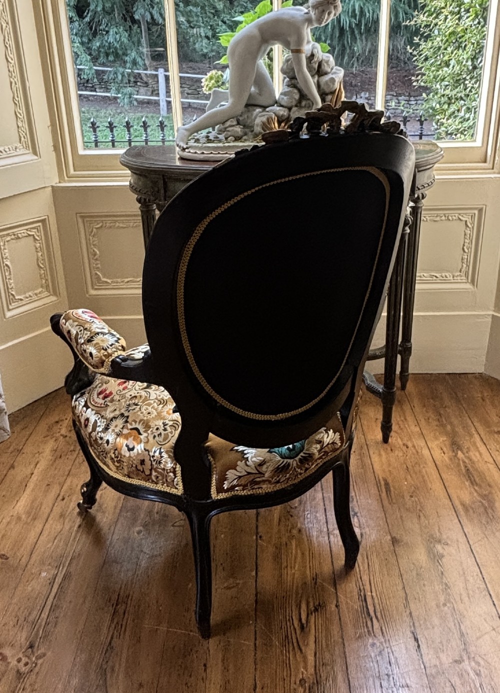 A pair of 19th-century French open armchairs with dark carved walnut frames, cabriole legs, and ornate gold silk brocade upholstery featuring floral motifs. View VII