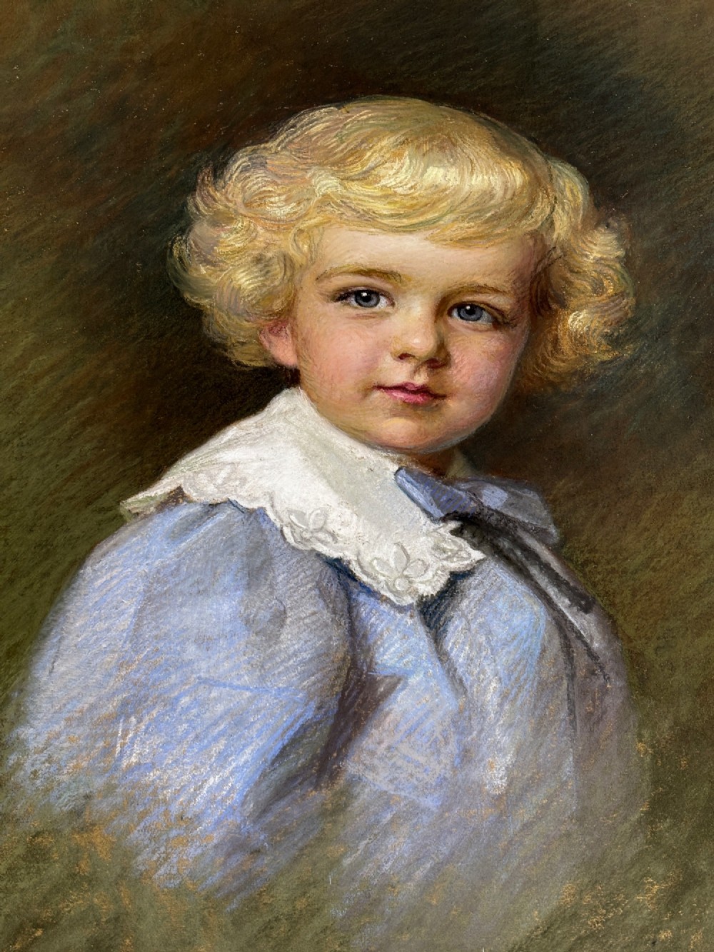 An antique pastel portrait of a blonde young boy wearing a blue garment and lace collar, presented in a dark green mount and an ornate gold gilt frame. View III