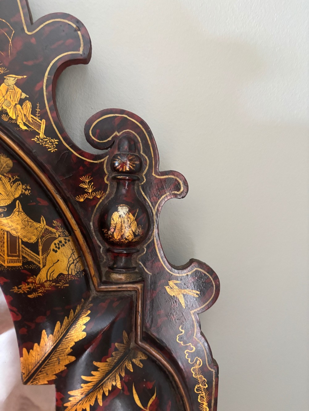 A pair of tall arched Queen Anne style pier mirrors featuring black lacquered frames decorated with gilded chinoiserie motifs and star-etched glass upper panels. View V