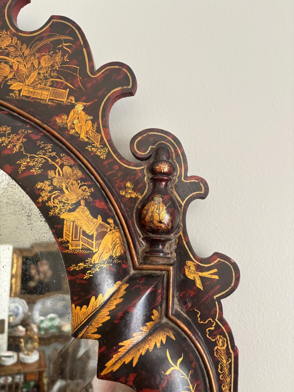 A pair of tall arched Queen Anne style pier mirrors featuring black lacquered frames decorated with gilded chinoiserie motifs and star-etched glass upper panels. View XIV