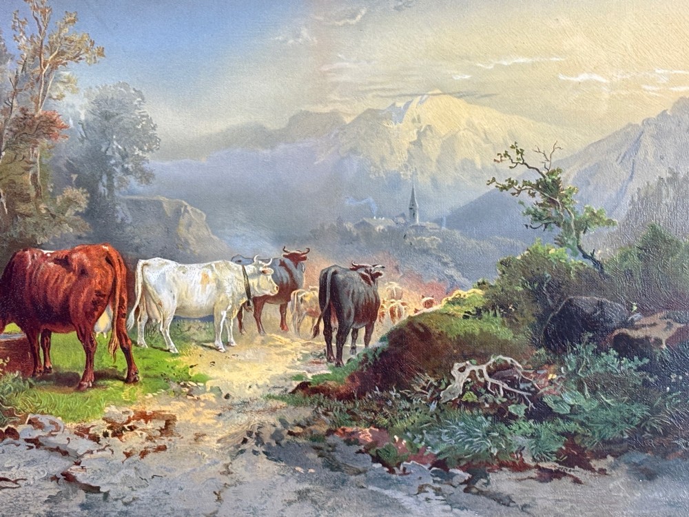 A pair of framed 19th-century pastoral oil paintings depicting rural landscapes with cattle and figures, set within matching giltwood frames. View V