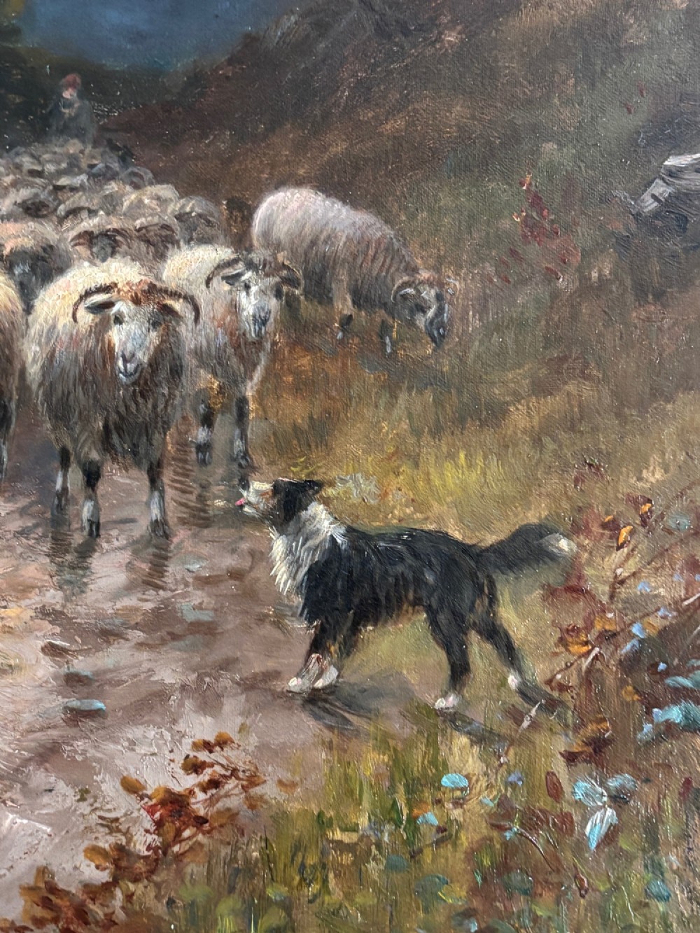 An oil painting on canvas depicting a flock of sheep and a sheepdog on a Scottish mountain path at sunset, presented in an ornate giltwood frame. View IV