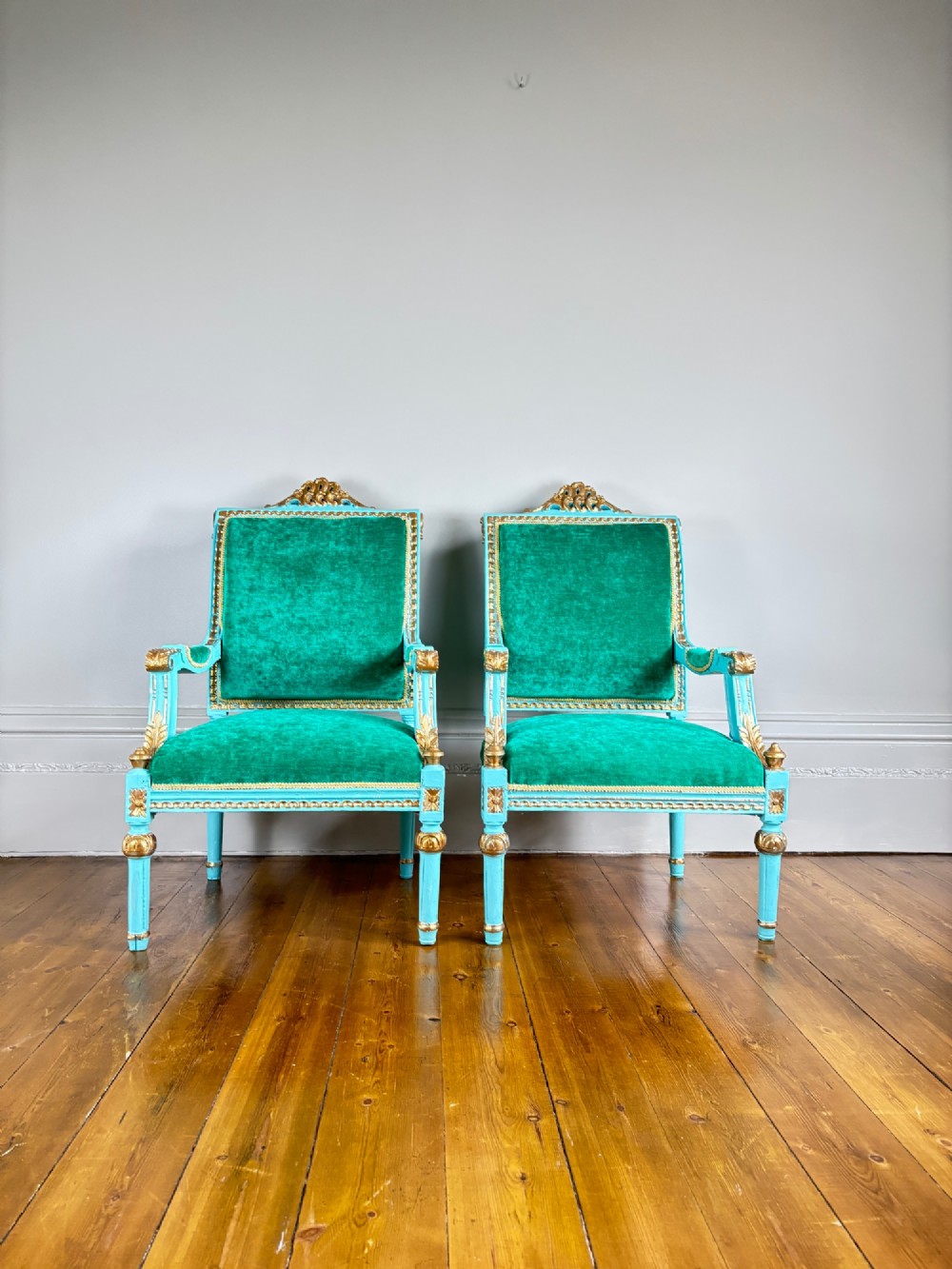 A pair of mid-19th-century French open armchairs featuring turquoise painted frames with gold gilt detailing and emerald green velvet upholstery. View II