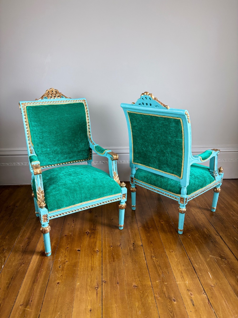 A pair of mid-19th-century French open armchairs featuring turquoise painted frames with gold gilt detailing and emerald green velvet upholstery. View VI