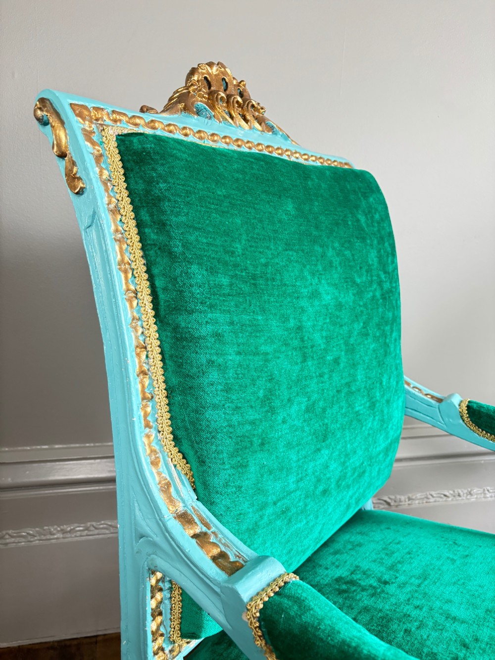 A pair of mid-19th-century French open armchairs featuring turquoise painted frames with gold gilt detailing and emerald green velvet upholstery. View VIII