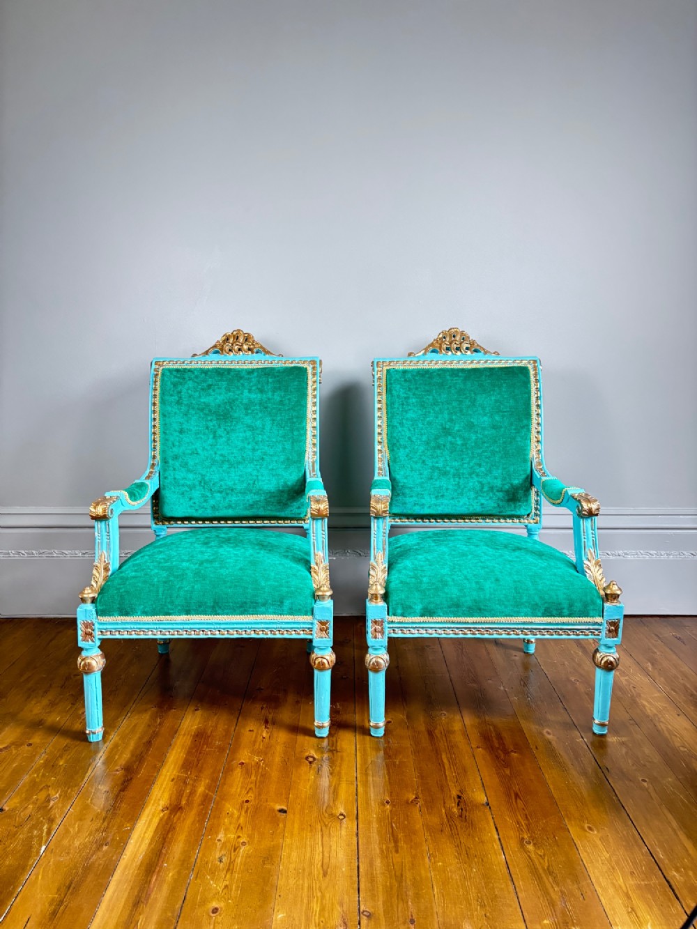 A pair of mid-19th-century French open armchairs featuring turquoise painted frames with gold gilt detailing and emerald green velvet upholstery. View IX