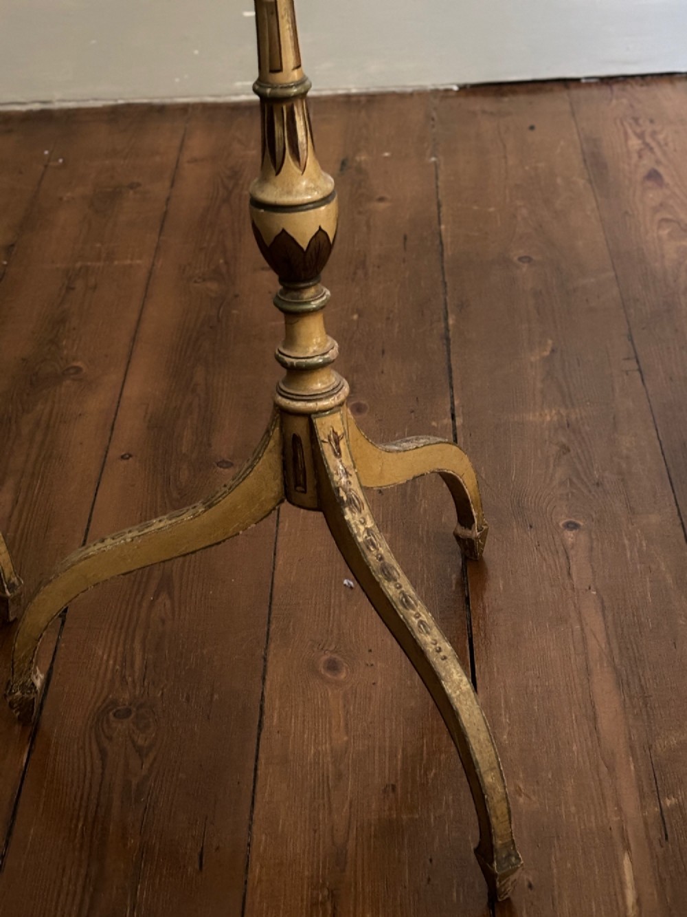 A pair of antique Georgian cream painted Hepplewhite pole screens featuring central oval vignettes depicting classical female figures with floral surround details on tripod spade-foot bases. View III