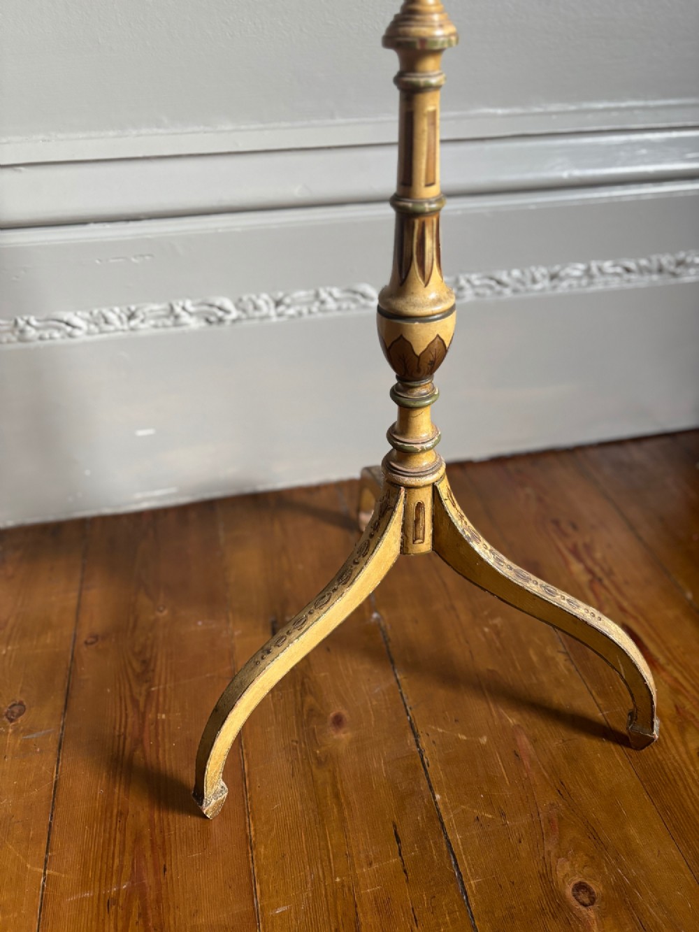 A pair of antique Georgian cream painted Hepplewhite pole screens featuring central oval vignettes depicting classical female figures with floral surround details on tripod spade-foot bases. View XIII