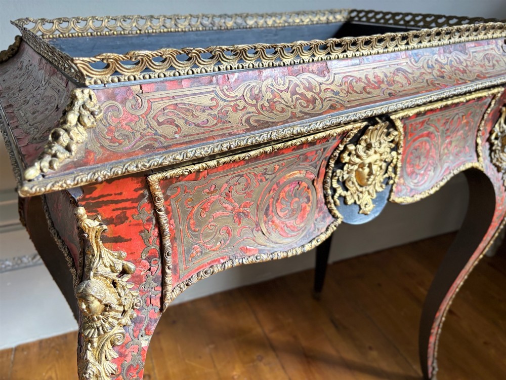 A 19th-century French Napoleon III jardiniere stand featuring red tortoiseshell and brass marquetry inlay, gilt bronze mounts, and curved cabriole legs. View IV