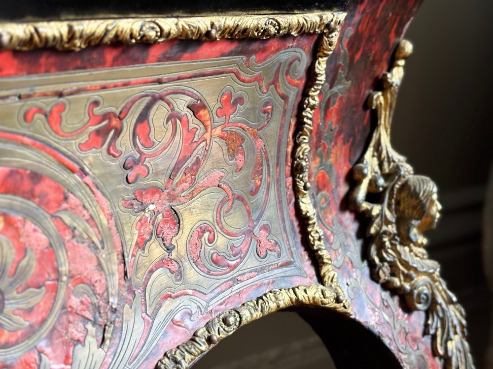 A 19th-century French Napoleon III jardiniere stand featuring red tortoiseshell and brass marquetry inlay, gilt bronze mounts, and curved cabriole legs. View VII