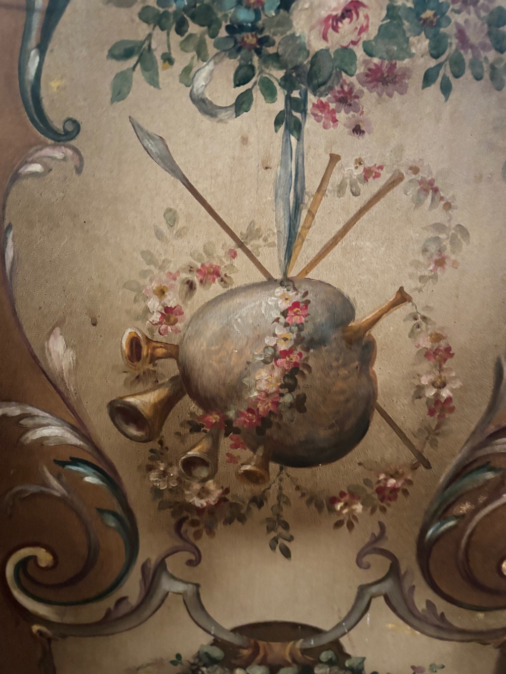 A French three-fold walnut screen featuring carved crestings and hand-painted panels depicting pastoral scenes, floral garlands, and musical trophies. View VIII