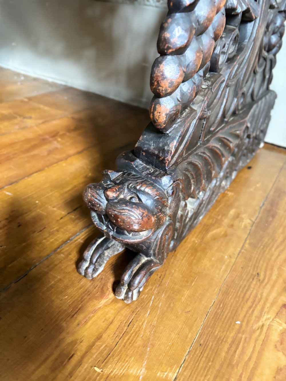 A 19th-century three-tiered Anglo-Indian padauk shelving unit featuring deeply carved floral friezes, openwork side panels, and sculpted feet. View VII