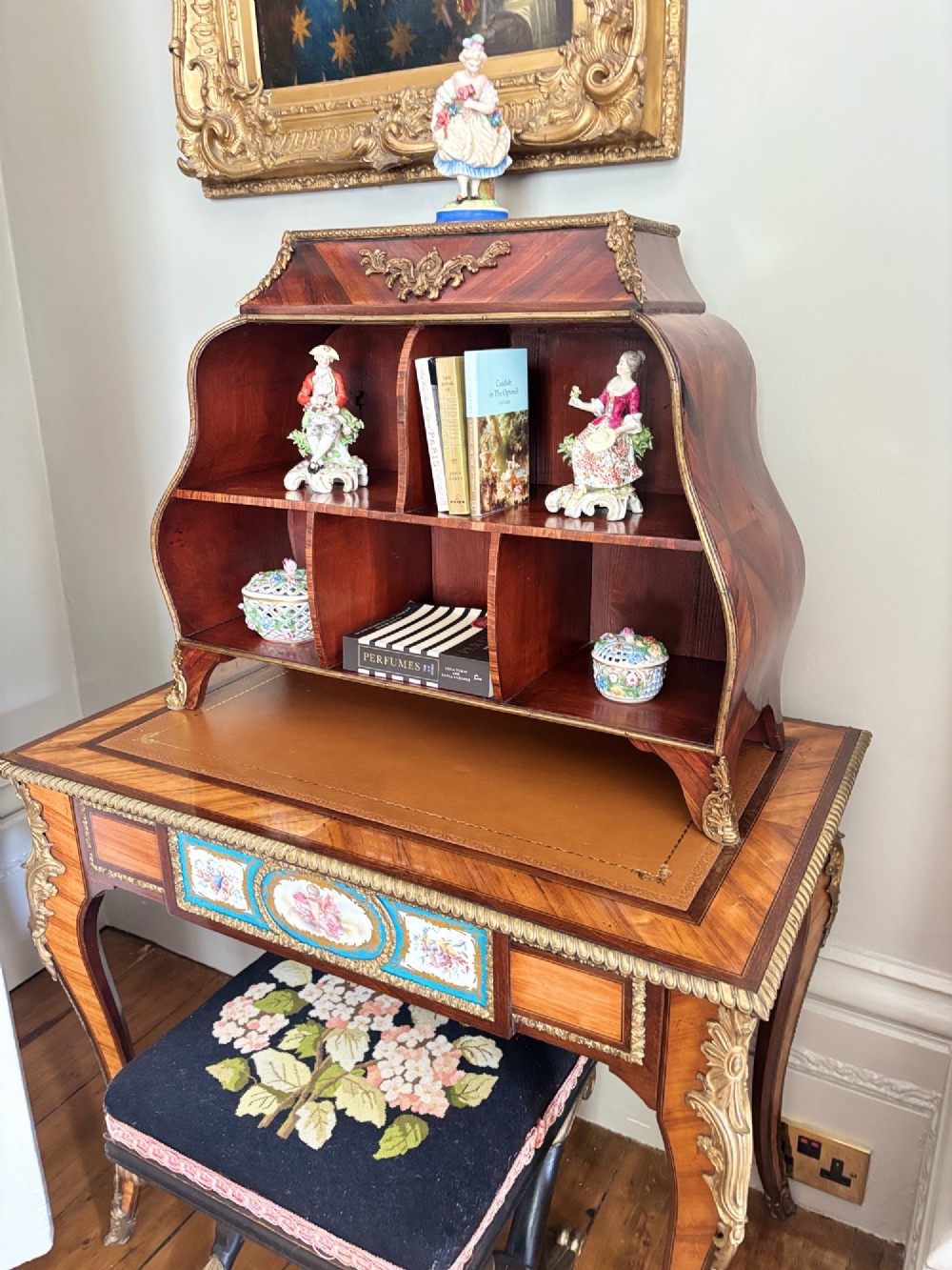 A Louis XV style rosewood desktop cartonnier featuring open compartmentalised shelves and gilded ormolu mounts along the crest and feet. View VIII