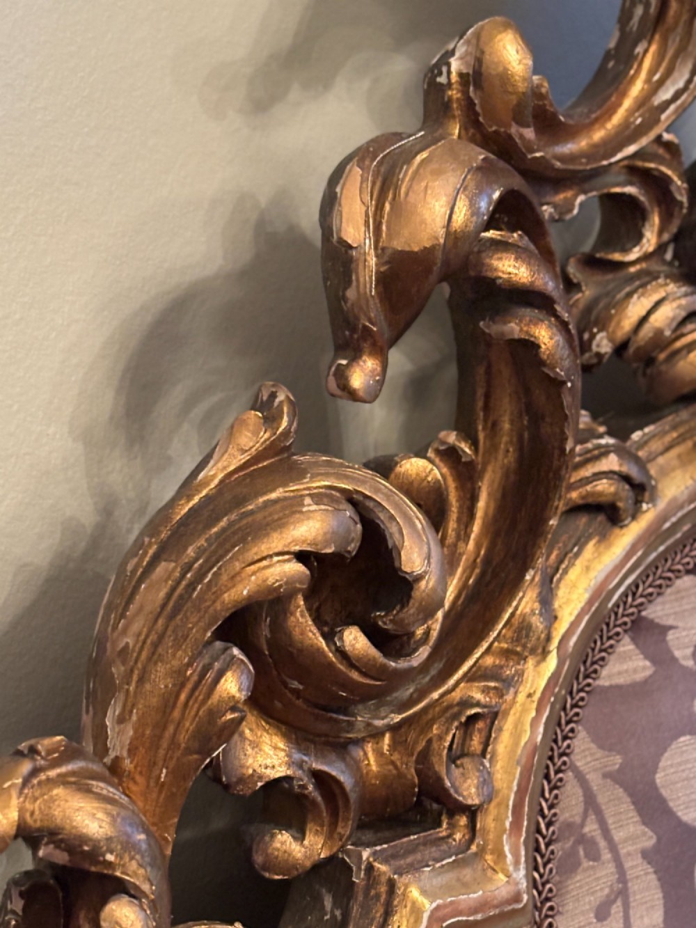 An Italian 19th-century Rococo style giltwood bed with shell crest carvings and purple floral damask upholstery on the headboard and footboard. View VI