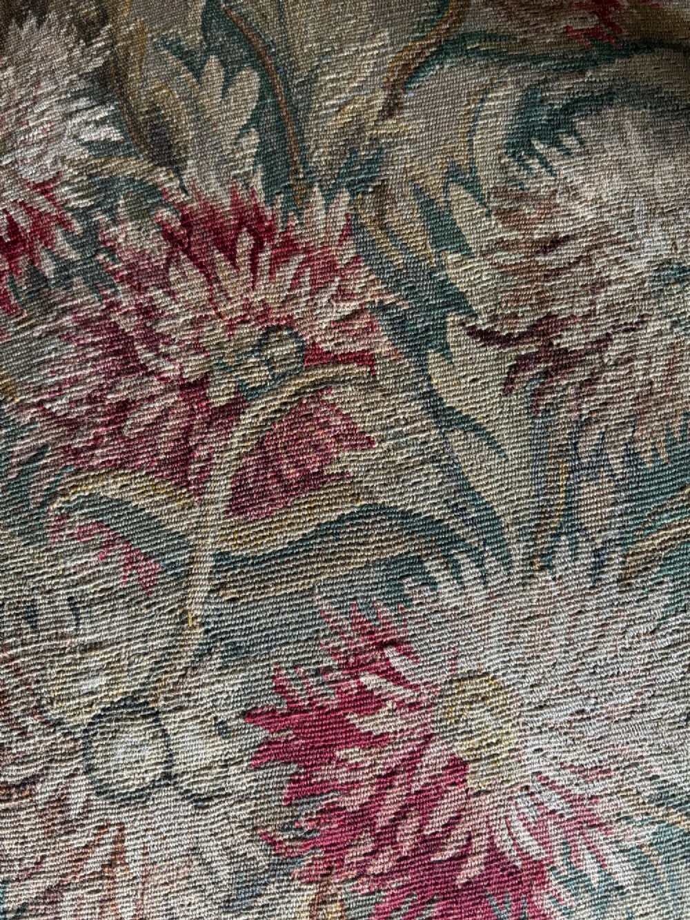 A late nineteenth-century French Regence style giltwood open armchair featuring floral tapestry upholstery and carved cabriole legs. View VII