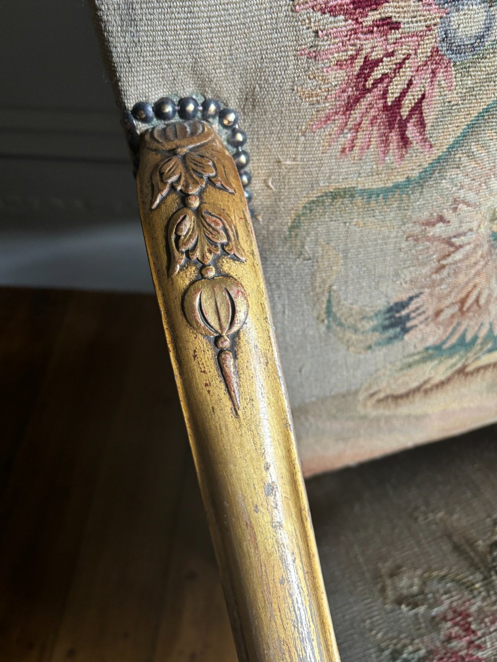 A late nineteenth-century French Regence style giltwood open armchair featuring floral tapestry upholstery and carved cabriole legs. View IX