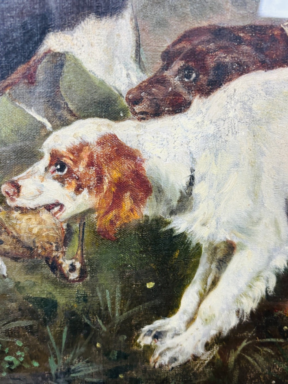 A framed oil painting on canvas depicting hunting dogs retrieving a game bird in a woodland clearing. View IV