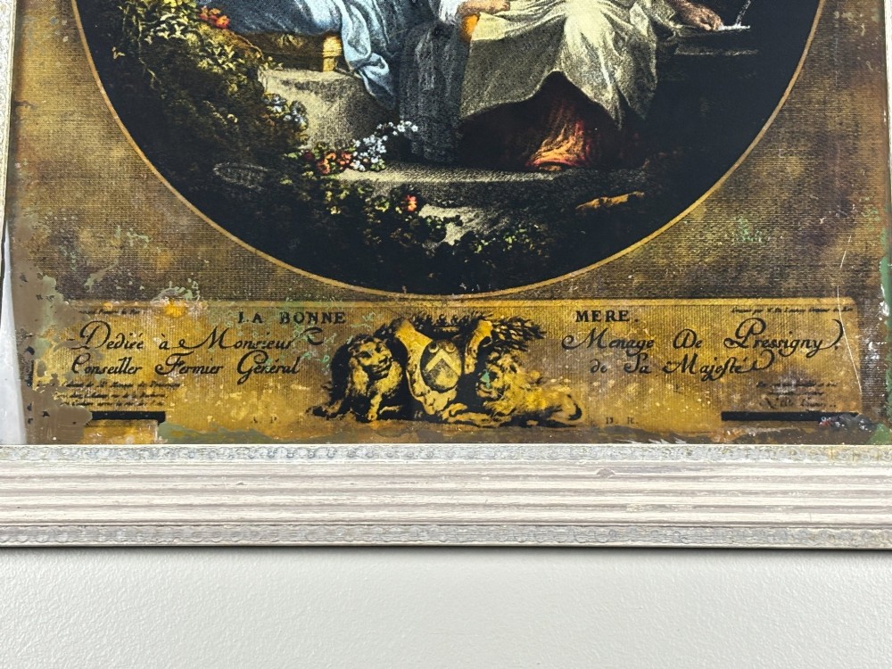A rectangular framed Georgian reverse glass print depicting a classical maternal scene titled La Bonne Mere set within an oval border. View III