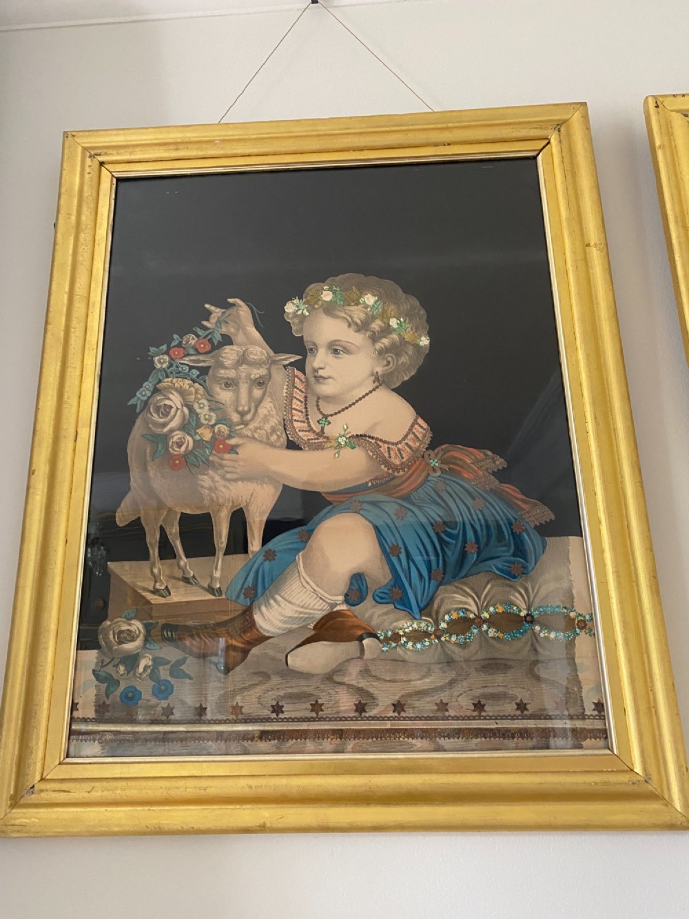 A pair of gilt-framed circa 1820 prints depicting young children with animals against dark backgrounds with metallic clothing embellishments. View III