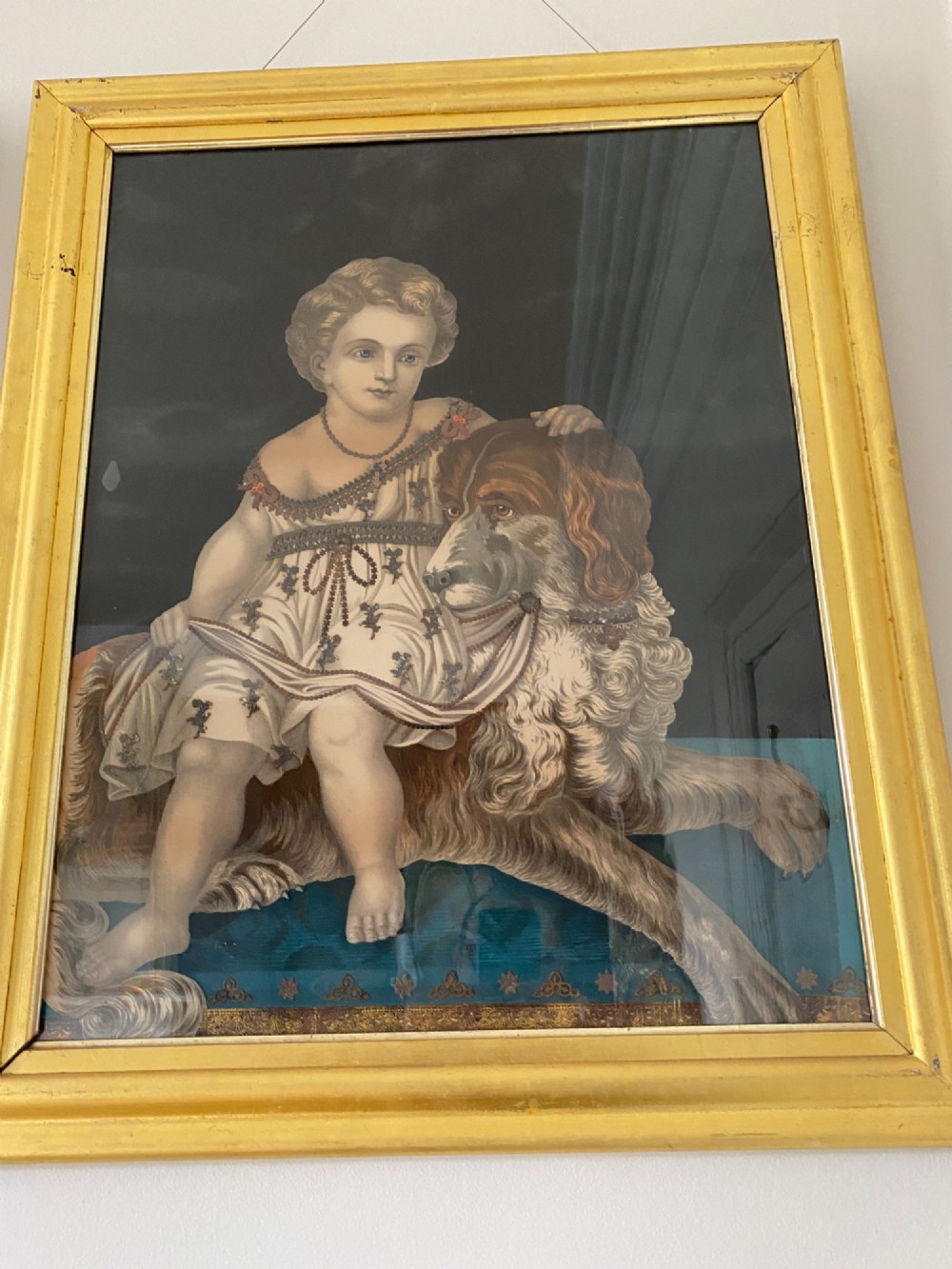 A pair of gilt-framed circa 1820 prints depicting young children with animals against dark backgrounds with metallic clothing embellishments. View IV