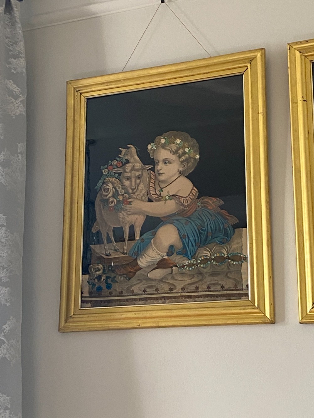 A pair of gilt-framed circa 1820 prints depicting young children with animals against dark backgrounds with metallic clothing embellishments. View VI