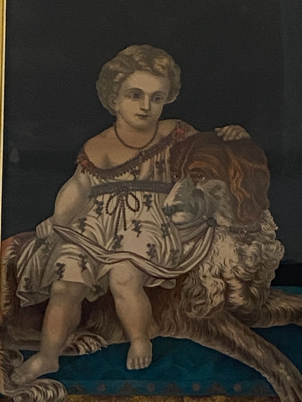 A pair of gilt-framed circa 1820 prints depicting young children with animals against dark backgrounds with metallic clothing embellishments. View VIII