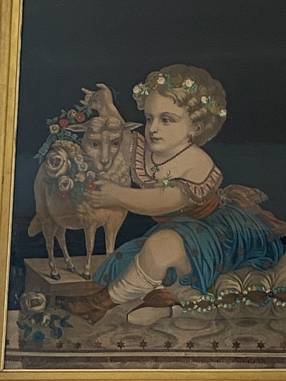 A pair of gilt-framed circa 1820 prints depicting young children with animals against dark backgrounds with metallic clothing embellishments. View IX