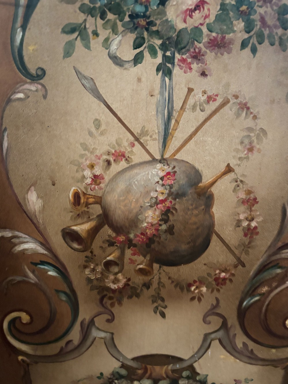 A three-panel French walnut folding screen featuring hand-painted pastoral scenes, floral garlands, scrollwork, and carved cresting. View VIII