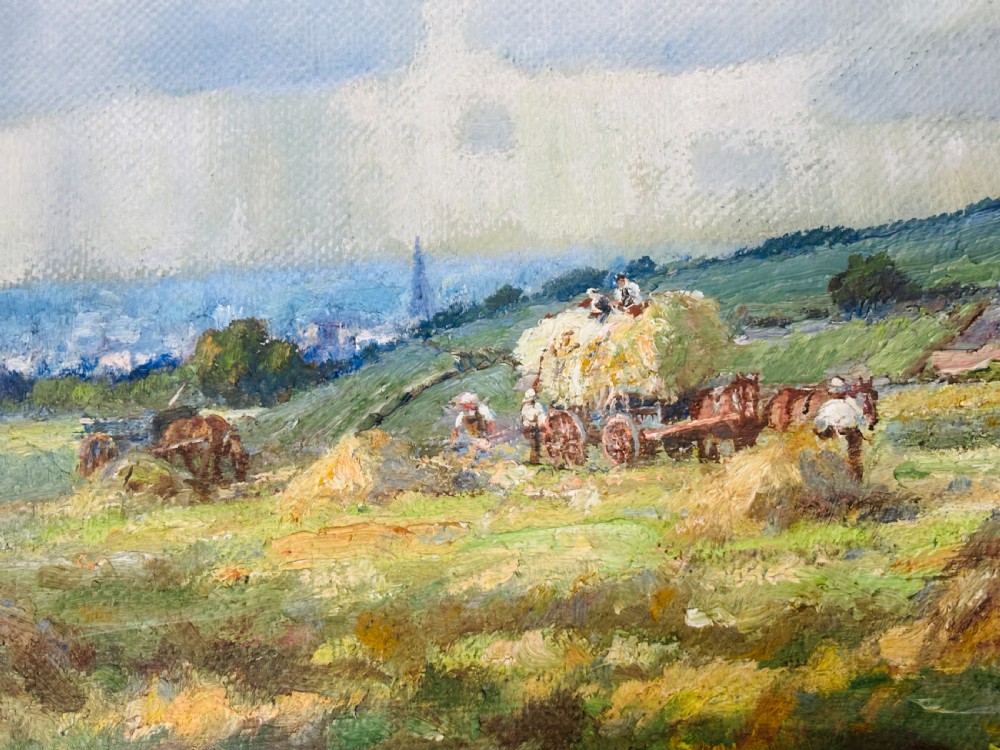 An Edwardian oil painting on board depicting a rural landscape with haystacks, cottages, and clouds set within a moulded frame. View III