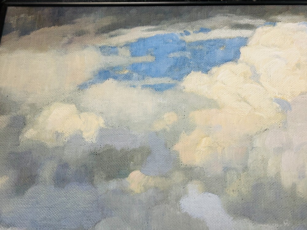 An Edwardian oil painting on board depicting a rural landscape with haystacks, cottages, and clouds set within a moulded frame. View V