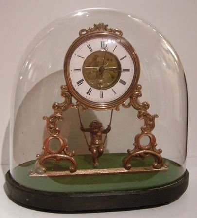 Antique Swinging Cherub Clock