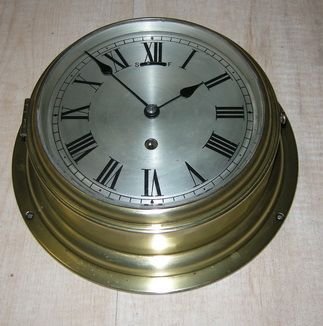 A Ships Clock with Silvered Dial